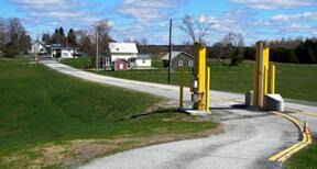 Morses Line today - looking from the U.S. border inspection station northward on Morses Line Road (Vt. Route 235.) The one-story white building with blue sign on the roof is the Morses Line, Que. border inspection station. There is little left of the once thriving hamlet of Morses Line - except the name.